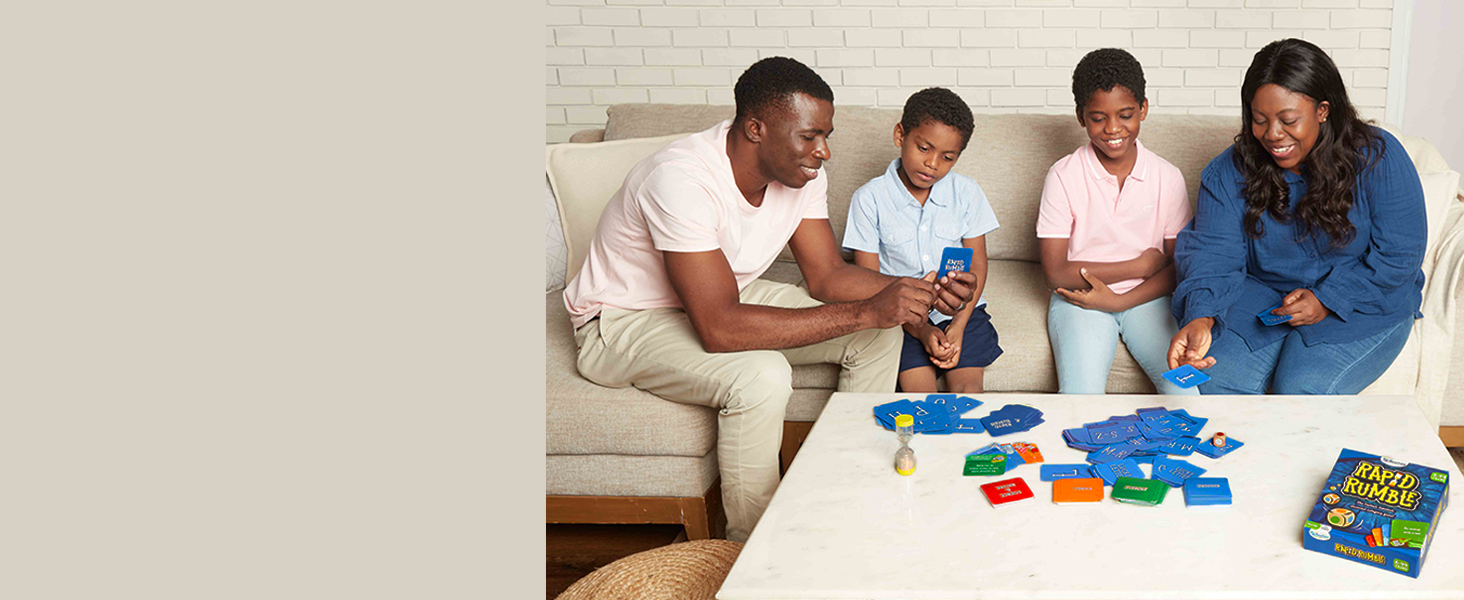 family playing with cards in board game